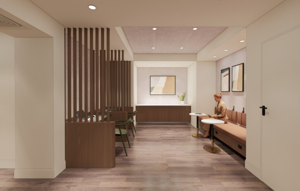A modern waiting room with wood flooring, a built-in bench, small round tables, chairs, abstract art on the walls, and a person seated. Wooden slats partially divide the space, and recessed lighting brightens the area.