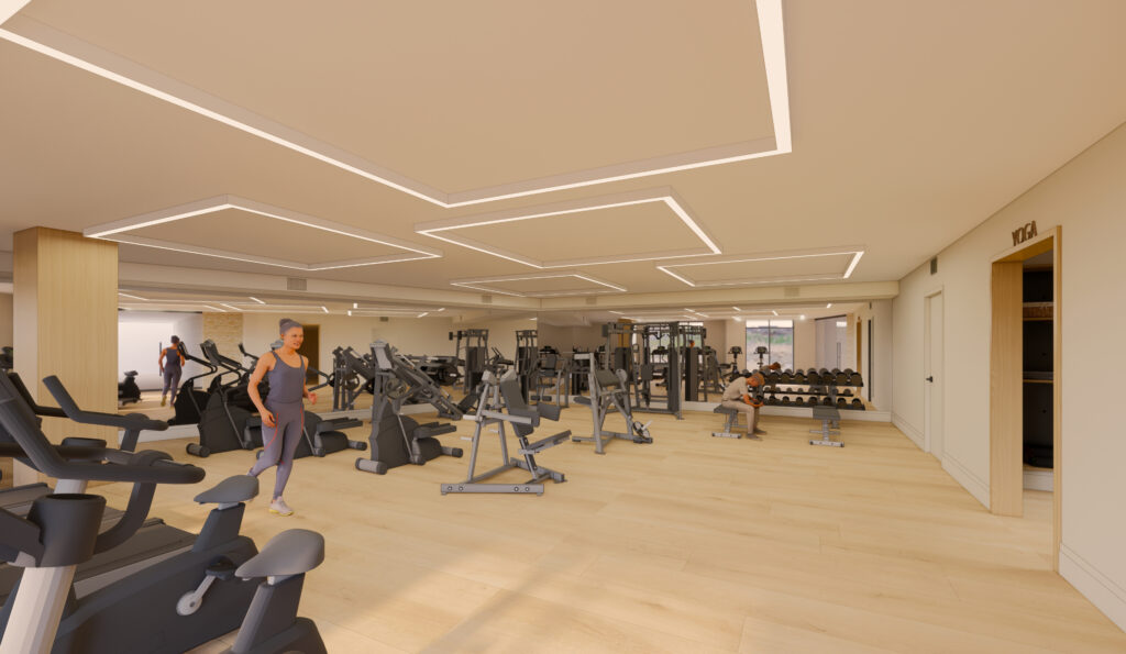 A spacious, modern gym with light wood floors, ceiling lights, cardio machines, weightlifting equipment, and several people working out in activewear.